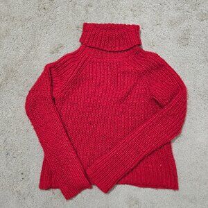 Red cable knit turtleneck sweater